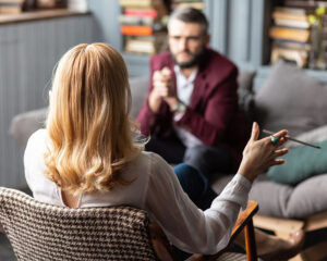Image of a man talking with an EMDR therapist in the Washington D.C. area. EMDR can help you overcome trauma, anxiety, depression, and more. We can help you overcome negative memories with EMDR therapy in Washington D.C. area 20817. Contact us today!