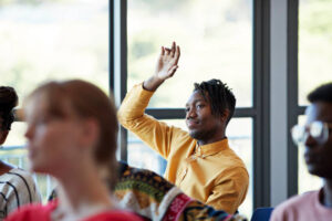 Image of a student raising their hand. Therapy for college students in Baltimore, MD helps address many stressors. Including depression in college students. You can enjoy this change in your life with counseling for college students. Reach out for more information now.