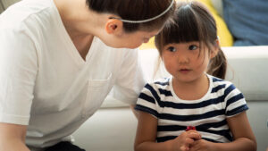 Image of a monther talking to get daughter as a part of child therapy in Washington DC. Getting support from a Baltimore child therapist can help relieve anxiety in children in Baltmore, Maryland, and the Washington DC area.