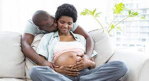 Image of a man kissing the cheek of a pregnant woman. Becoming parents is one of the changes that we can help with in life transitions counseling in Baltimore, MD. It is okay to need support and that is what our Maryland therapists in Columbia, MD provide. Even if you are in the Washington D.C. area we have a online therapist who can support you. Call today! 