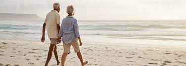 Image of an older couple walking on a beach. Getting older or having an illness are also things that we address in life transitions therapy in Maryland. Or you can get support through moving or changing jobs in life transitions counseling. Reach out now to gain support if you are in Baltimore, Columbia, the Washington D.C. area, or anywhere else in Maryland. Call today!