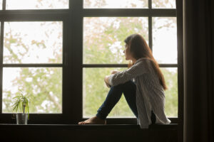 Image of a woman looking pensively out of her window. Are you looking for anxiety therapy in the Washington D.C. area for your anxiety symptoms? Our Baltimore anxiety therapist can give you the tools to feel better. Reach out today to start anxiety treatment in Baltimore, MD 21043.