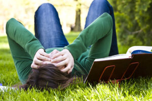 Image of a person in a green sweater laying on the grass. Are you experiencing depression symptoms in Baltimore, MD? Then we can help with depression treatment in the Washington D.C. area. Get depression help from a depression therapist in Columbia and Baltimore, MD. Call today 
