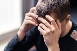 Image of a man covering his face. If you need depression help our depression therapist in Columbia, MD is here for you. Ready to get rid of depression symptoms in the Washington D.C. area? Then contact us about depression treatment in Baltimore, MD today! Call now!